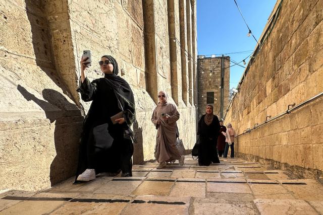 Palestinians arrive to celebrate the Islamic Hijri New Year at the Ibrahimi Mosque, known to Jews as the Cave of the Patriarchs, located inside the Israeli-controlled H2 sector of the occupied West Bank city of Hebron, on June 16, 2026. Israel's finance minister said on June 16, he had stripped Palestinians of authority over the site of the Cave of Patriarchs, known to Muslims as the Ibrahimi Mosque, in the occupied West Bank. The move to transfer management of the site to an Israeli committee controlled by the far-right minister, drew swift condemnation from the Palestinian Authority. (Photo by Hazem BADER / AFP)