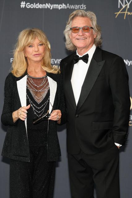 US actress Goldie Hawn and US actor Kurt Russell arrive for the closing ceremony of the 65th Monte-Carlo Television Festival in Monaco on June 16, 2026. (Photo by Valery HACHE / AFP)