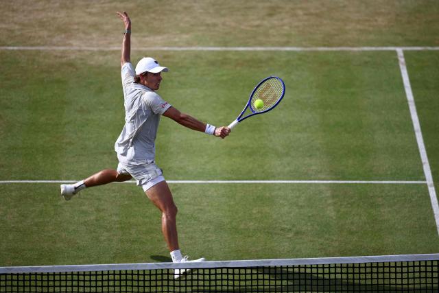 Australia's Alex de Minaur returns to Canada's Gabriel Dialloin their men's singles round of 32 tennis match on day two of the ATP HSBC Championships at Queen's Club in west London on June 16, 2026. De Minaur won the match 7-6, 6-3. (Photo by Henry Nicholls / AFP)