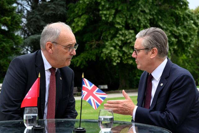 Switzerland's President Guy Parmelin (L) and Britain's Prime Minister Keir Starmer speak during a bilateral meeting at the Hotel Royal on the sideline of the G7 summit, in Evian, eastern France, on June 16, 2026. A G7 summit is set to take place June 15 to 17 in the French town of Evian-les-Bains near Switzerland and it will be attended by country leaders as well as the EU's foreign policy chief and ministers from Brazil, Canada, the United Arab Emirates and Turkey. (Photo by LAURENT GILLIERON / POOL / AFP)