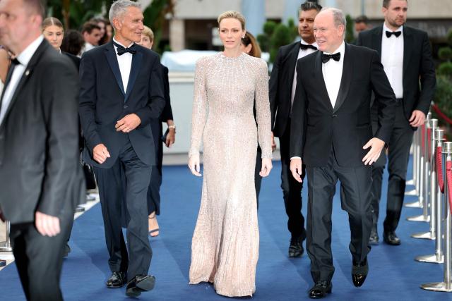 Princess Charlene of Monaco (C) and Prince's Albert II of Monaco (R) arrive for the closing ceremony of the 65th Monte-Carlo Television Festival in Monaco on June 16, 2026. (Photo by Valery HACHE / AFP) / / NO TABLOIDS WEB & PRINT, NO DAILY MAIL, NO DAILY MAIL GROUP, NO VOICI, NO CLOSER