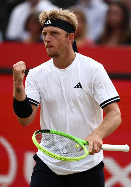 Spain's Alejandro Davidovich Fokina celebrates match point against Britain's Cameron Norrie after winning their men's singles round of 32 tennis match on day two of the ATP HSBC Championships at Queen's Club in west London on June 16, 2026. (Photo by Henry Nicholls / AFP)