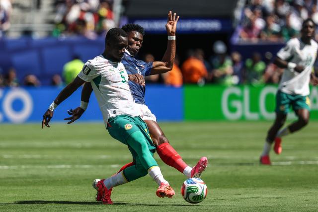 Senegal's midfielder #05 Idrissa Gana Gueye and France's midfielder #08 Aurelien Tchouameni fight for the ball during the 2026 World Cup Group I football match between France and Senegal at the New York/New Jersey Stadium in East Rutherford on June 16, 2026.  (Photo by FRANCK FIFE / AFP)