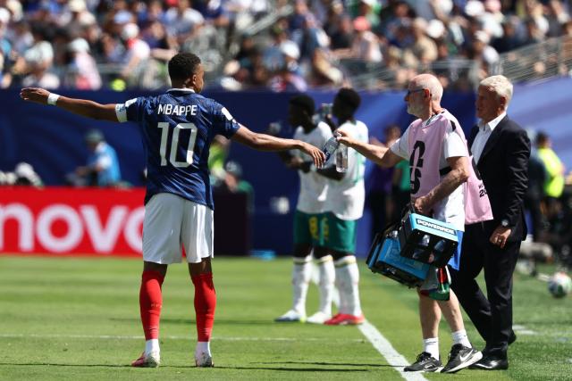 France's forward #10 Kylian Mbappe receives water during the 2026 World Cup Group I football match between France and Senegal at the New York/New Jersey Stadium in East Rutherford on June 16, 2026.  (Photo by FRANCK FIFE / AFP)