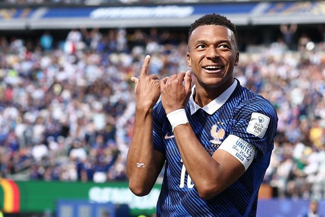 France's forward #10 Kylian Mbappe celebrates after scoring his team's first goal during the 2026 World Cup Group I football match between France and Senegal at the New York/New Jersey Stadium in East Rutherford on June 16, 2026.  (Photo by CHARLY TRIBALLEAU / AFP)