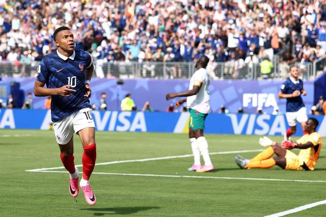 France's forward #10 Kylian Mbappe celebrates after scoring his team's first goal during the 2026 World Cup Group I football match between France and Senegal at the New York/New Jersey Stadium in East Rutherford on June 16, 2026.  (Photo by CHARLY TRIBALLEAU / AFP)