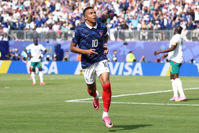 France's forward #10 Kylian Mbappe celebrates after scoring his team's first goal during the 2026 World Cup Group I football match between France and Senegal at the New York/New Jersey Stadium in East Rutherford on June 16, 2026.  (Photo by CHARLY TRIBALLEAU / AFP)