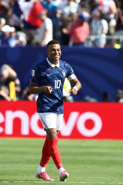 France's forward #10 Kylian Mbappe celebrates after scoring his team's first goal during the 2026 World Cup Group I football match between France and Senegal at the New York/New Jersey Stadium in East Rutherford on June 16, 2026.  (Photo by FRANCK FIFE / AFP)