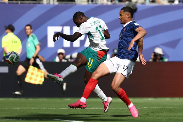 Senegal's forward #11 Nicolas Jackson shoots to score a goal later disallowed for offside next to France's defender #17 William Saliba during the 2026 World Cup Group I football match between France and Senegal at the New York/New Jersey Stadium in East Rutherford on June 16, 2026.  (Photo by FRANCK FIFE / AFP)