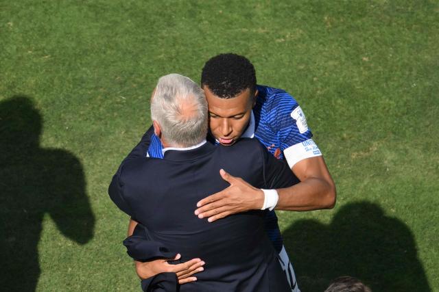 France's forward #10 Kylian Mbappe celebrates scoring his team's first goal with France's head coach Didier Deschamps during the 2026 World Cup Group I football match between France and Senegal at the New York/New Jersey Stadium in East Rutherford on June 16, 2026. (Photo by Angela WEISS / AFP)