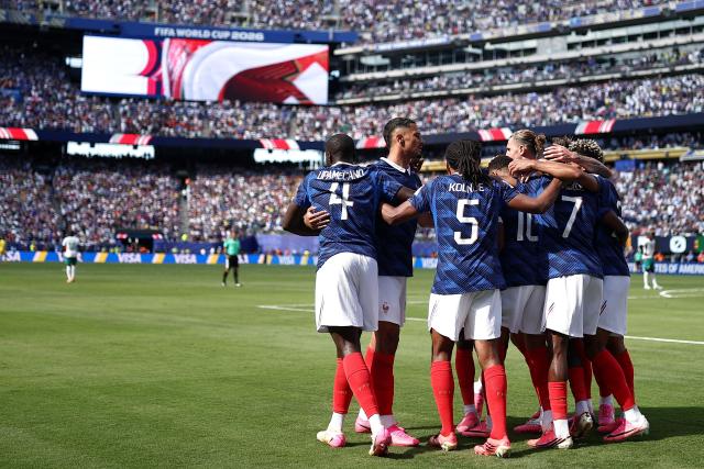 France players celebrate after scoring their first goal during the 2026 World Cup Group I football match between France and Senegal at the New York/New Jersey Stadium in East Rutherford on June 16, 2026.  (Photo by CHARLY TRIBALLEAU / AFP)