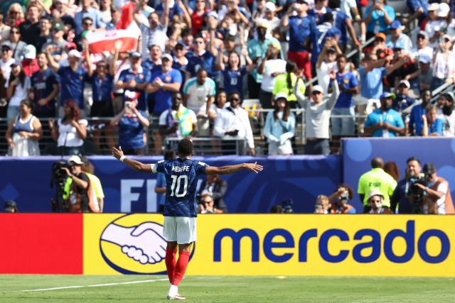 France's forward #10 Kylian Mbappe celebrates after scoring his team's first goal during the 2026 World Cup Group I football match between France and Senegal at the New York/New Jersey Stadium in East Rutherford on June 16, 2026.  (Photo by FRANCK FIFE / AFP)