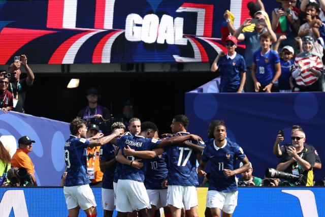 France players celebrate after scoring their first goal during the 2026 World Cup Group I football match between France and Senegal at the New York/New Jersey Stadium in East Rutherford on June 16, 2026.  (Photo by FRANCK FIFE / AFP)
