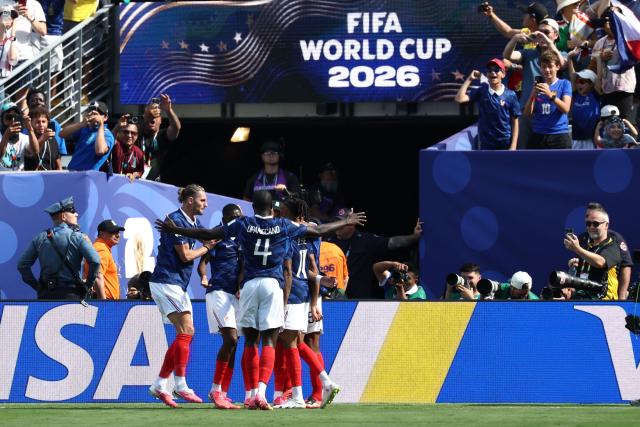 France players celebrate after scoring their first goal during the 2026 World Cup Group I football match between France and Senegal at the New York/New Jersey Stadium in East Rutherford on June 16, 2026.  (Photo by FRANCK FIFE / AFP)