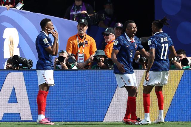 France's forward #10 Kylian Mbappe (L) celebrates with teammates defender #05 Jules Kounde and forward #11 Michael Olise after scoring his team's first goal during the 2026 World Cup Group I football match between France and Senegal at the New York/New Jersey Stadium in East Rutherford on June 16, 2026.  (Photo by FRANCK FIFE / AFP)
