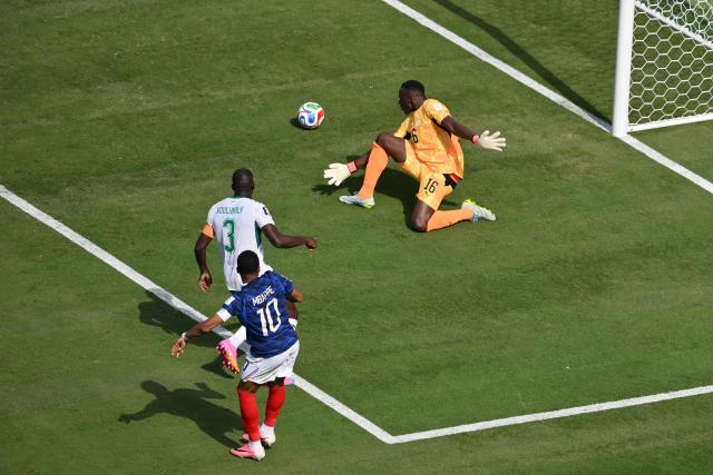 France's forward #10 Kylian Mbappe scores his team's first during the 2026 World Cup Group I football match between France and Senegal at the New York/New Jersey Stadium in East Rutherford on June 16, 2026. (Photo by Angela WEISS / AFP)