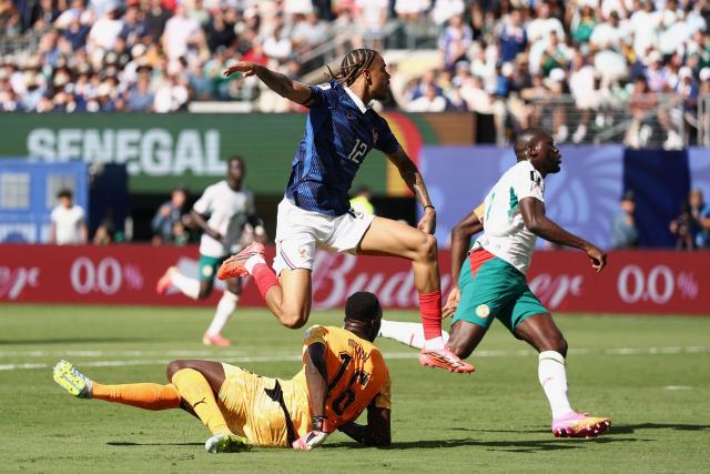 France's forward #12 Bradley Barcola scores his team's second goal during the 2026 World Cup Group I football match between France and Senegal at the New York/New Jersey Stadium in East Rutherford on June 16, 2026.  (Photo by CHARLY TRIBALLEAU / AFP)