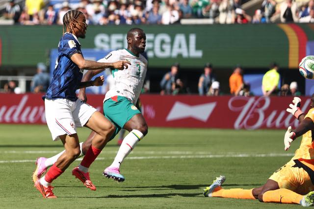France's forward #12 Bradley Barcola scores his team's second goal during the 2026 World Cup Group I football match between France and Senegal at the New York/New Jersey Stadium in East Rutherford on June 16, 2026.  (Photo by CHARLY TRIBALLEAU / AFP)