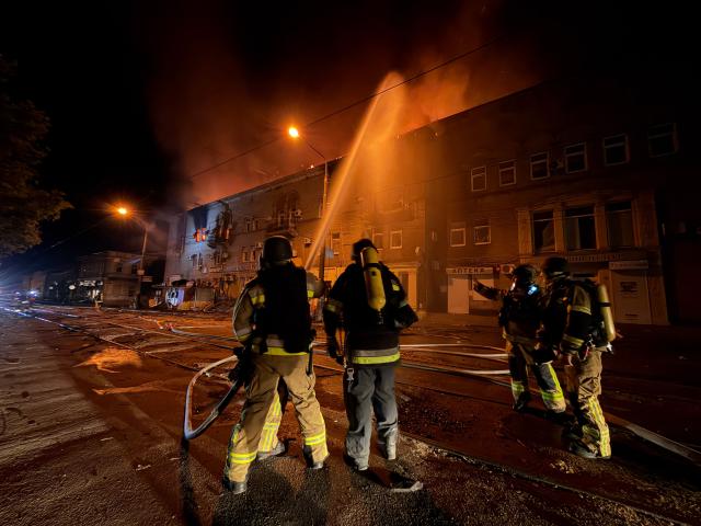Firefighters try to put out a fire in a residential building following an airstrike in Zaporizhzhia on June 16, 2026, amid the Russian invasion of Ukraine. (Photo by Darya NAZAROVA / AFP)