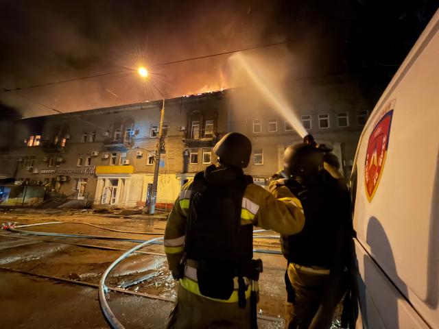 Firefighters try to put out a fire in a residential building following an airstrike in Zaporizhzhia on June 16, 2026, amid the Russian invasion of Ukraine. (Photo by Darya NAZAROVA / AFP)