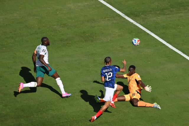 France's forward #12 Bradley Barcola scores his team's second goal during the 2026 World Cup Group I football match between France and Senegal at the New York/New Jersey Stadium in East Rutherford on June 16, 2026. (Photo by Angela WEISS / AFP)