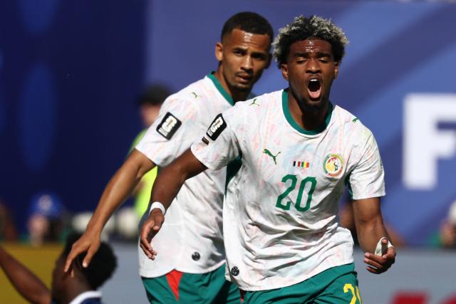 Senegal's forward #20 Ibrahim Mbaye celebrates after scoring his team's first goal during the 2026 World Cup Group I football match between France and Senegal at the New York/New Jersey Stadium in East Rutherford on June 16, 2026.  (Photo by FRANCK FIFE / AFP)