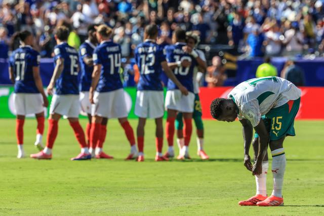 Senegal's defender #15 Krepin Diatta reacts after losing the 2026 World Cup Group I football match between France and Senegal at the New York/New Jersey Stadium in East Rutherford on June 16, 2026.  (Photo by TIMOTHY A. CLARY / AFP)