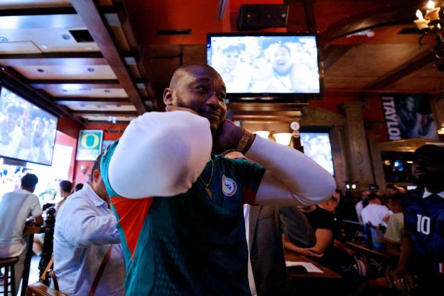 A Senegal fan reacts after a goal against his team as people watch the 2026 World Cup football match between France and Senegal at Legends Bar in New York, on June 16, 2026. (Photo by Leonardo MUNOZ / AFP)