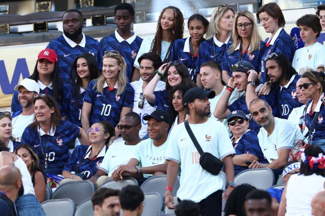 France's forward #10 Kylian Mbappe poses for a picture with relatives and friends in the stands after the 2026 World Cup Group I football match between France and Senegal at the New York/New Jersey Stadium in East Rutherford on June 16, 2026.  (Photo by FRANCK FIFE / AFP)