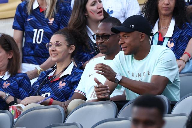 France's forward #10 Kylian Mbappe gestures in the stands alongside relatives and friends after the 2026 World Cup Group I football match between France and Senegal at the New York/New Jersey Stadium in East Rutherford on June 16, 2026.  (Photo by FRANCK FIFE / AFP)