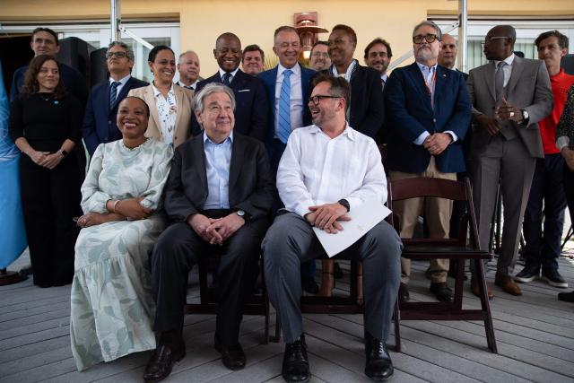 United Nations Secretary-General Antonio Guterres (C) poses with UN representatives in the Petion-Ville commune of Port-au-Prince, Haiti, on June 16, 2026. UN chief Antonio Guterres apologized to Haitians Tuesday for what he said was their abandonment by the international community but noted during a visit to the violence-plagued Caribbean nation that there were "glimmers" of hope. (Photo by Clarens SIFFROY / AFP)