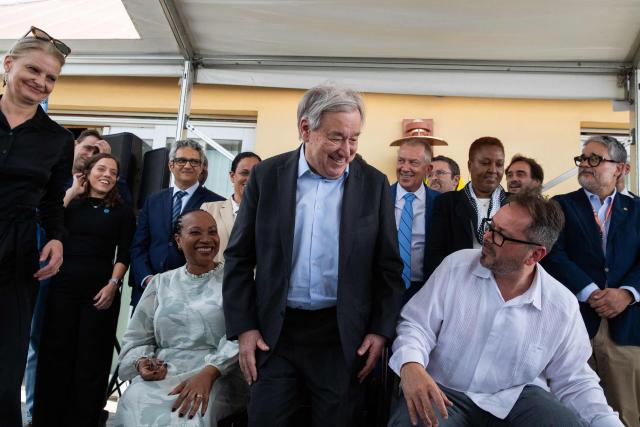 United Nations Secretary-General Antonio Guterres (C) poses with UN representatives in the Petion-Ville commune of Port-au-Prince, Haiti, on June 16, 2026. UN chief Antonio Guterres apologized to Haitians Tuesday for what he said was their abandonment by the international community but noted during a visit to the violence-plagued Caribbean nation that there were "glimmers" of hope. (Photo by Clarens SIFFROY / AFP)