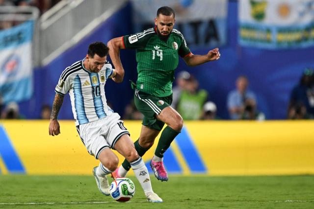 Argentina's forward #10 Lionel Messi and Algeria's midfielder #19 Nabil Bentaleb fight for the ball during the 2026 World Cup Group J football match between Argentina and Algeria at the Kansas City Stadium in Kansas City on June 16, 2026.  (Photo by ROBERTO SCHMIDT / AFP)