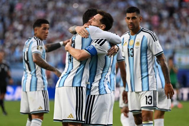 Argentina's forward #10 Lionel Messi celebrates with teammate midfielder #07 Rodrigo De Paul scoring his team's first goal during the 2026 World Cup Group J football match between Argentina and Algeria at the Kansas City Stadium in Kansas City on June 16, 2026.  (Photo by ROBERTO SCHMIDT / AFP)