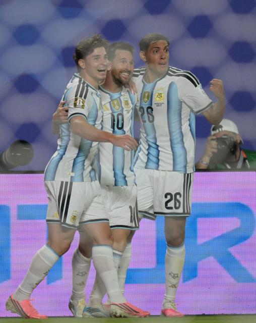 Argentina's forward #10 Lionel Messi celebrates with teammates  forward #09 Julian Alvarez and defender #26 Nahuel Molina scoring his team's second goal during the 2026 World Cup Group J football match between Argentina and Algeria at the Kansas City Stadium in Kansas City on June 16, 2026.  (Photo by JUAN MABROMATA / AFP)