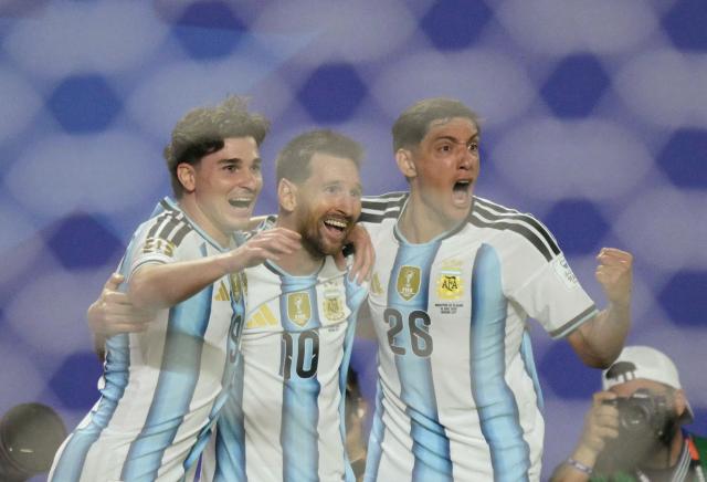 Argentina's forward #10 Lionel Messi celebrates with teammates  forward #09 Julian Alvarez and defender #26 Nahuel Molina scoring his team's second goal during the 2026 World Cup Group J football match between Argentina and Algeria at the Kansas City Stadium in Kansas City on June 16, 2026.  (Photo by JUAN MABROMATA / AFP)
