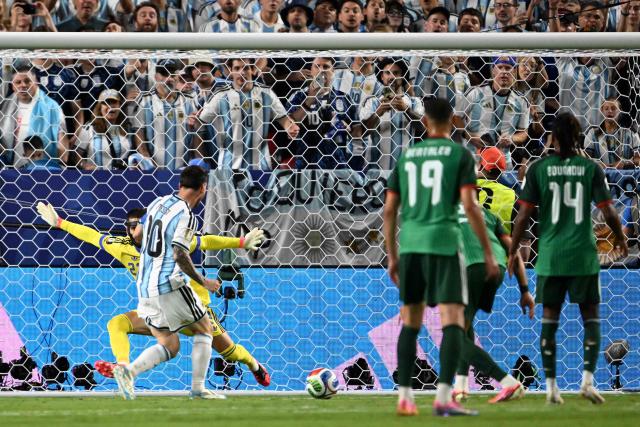 Argentina's forward #10 Lionel Messi shoots and scores his team's second goal during the 2026 World Cup Group J football match between Argentina and Algeria at the Kansas City Stadium in Kansas City on June 16, 2026.  (Photo by ROBERTO SCHMIDT / AFP)
