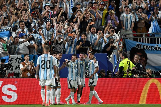 Argentina's forward #10 Lionel Messi celebrates with teammates scoring his team's third goal during the 2026 World Cup Group J football match between Argentina and Algeria at the Kansas City Stadium in Kansas City on June 16, 2026.  (Photo by ROBERTO SCHMIDT / AFP)