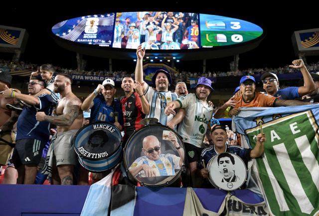 Argentina's fans celebrate at the end of the 2026 World Cup Group J football match between Argentina and Algeria at the Kansas City Stadium in Kansas City on June 16, 2026.  (Photo by JUAN MABROMATA / AFP)