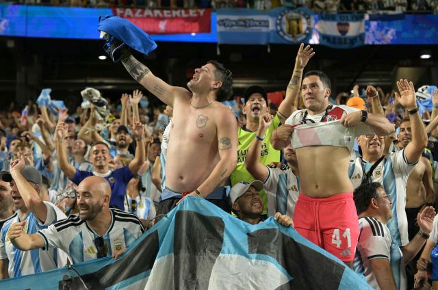 Argentina's fans celebrate at the end of the 2026 World Cup Group J football match between Argentina and Algeria at the Kansas City Stadium in Kansas City on June 16, 2026.  (Photo by JUAN MABROMATA / AFP)