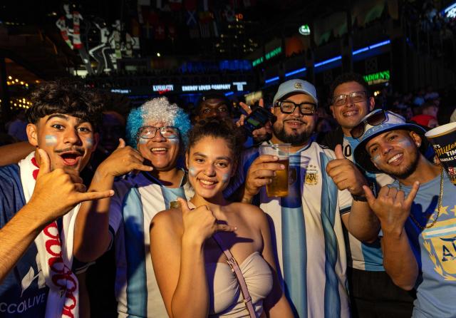 Argentina's fans celebrate as they watch the 2026 World Cup football tournament match between Argentina and Algeria at the Power & Light District in Kansas City, Missouri, on June 16, 2026. (Photo by Austin Johnson / AFP)