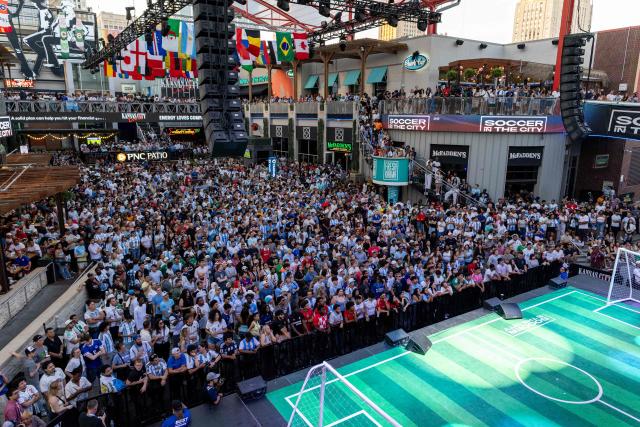 Football fans watch the 2026 World Cup football tournament match between Argentina and Algeria at the Power & Light District in Kansas City, Missouri, on June 16, 2026. (Photo by Austin Johnson / AFP)