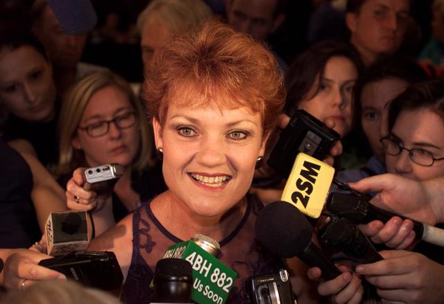(FILES) In a file picture taken on February 17, 2001 far-right, anti-immigration advocate and former MP, Pauline Hanson, talks surrounded by media in the tally room of the Queensland state election, in Brisbane. The leader of Australia's ascendant far-right party assailed "radical Islam" and the media on June 17, 2026, and vowed to pull the country out of international organisations in an address briefly interrupted by the unfurling of a protest banner. (Photo by TORSTEN BLACKWOOD and GREG WOOD / AFP FILES / AFP)