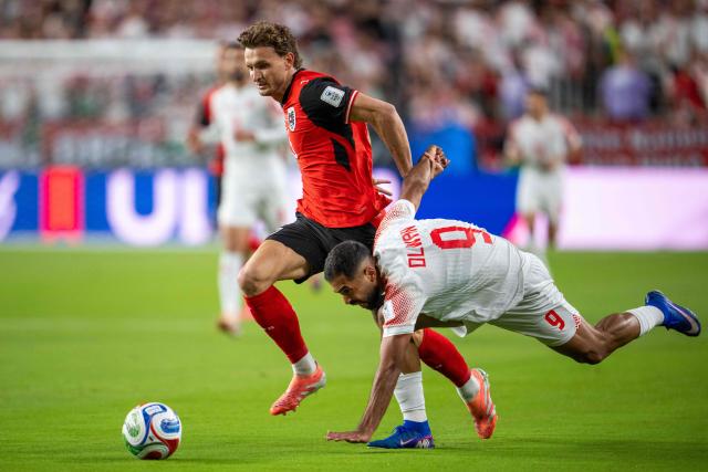 Austria's defender #05 Stefan Posch and Jordan's forward #09 Ali Olwan fight for the ball during the 2026 World Cup Group J football match between Austria and Jordan at the San Francisco Bay Area Stadium in Santa Clara, on June 16, 2026.  (Photo by GEORG HOCHMUTH / APA / AFP) / Austria OUT / SOUTH TYROL OUT
