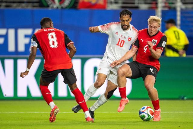 Austria's midfielder #04 Xaver Schlager and Jordan's forward #10 Mousa Altamari fight for the ball during the 2026 World Cup Group J football match between Austria and Jordan at the San Francisco Bay Area Stadium in Santa Clara, on June 16, 2026.  (Photo by GEORG HOCHMUTH / APA / AFP) / Austria OUT / SOUTH TYROL OUT