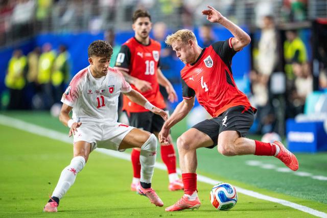 Austria's midfielder #04 Xaver Schlager and Jordan's forward #11 Odeh Fakhoury fight for the ball during the 2026 World Cup Group J football match between Austria and Jordan at the San Francisco Bay Area Stadium in Santa Clara, on June 16, 2026.  (Photo by GEORG HOCHMUTH / APA / AFP) / Austria OUT / SOUTH TYROL OUT