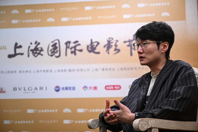 Chinese filmmaker Qiu Sheng takes part in an interview with AFP during the 28th Shanghai International Film Festival in Shanghai on June 17, 2026. (Photo by Jade GAO / AFP)