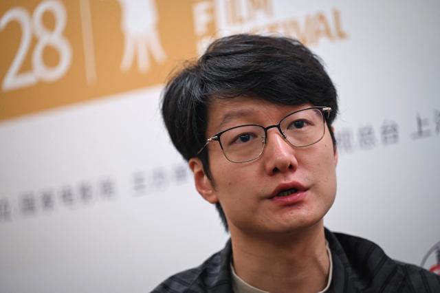 Chinese filmmaker Qiu Sheng takes part in an interview with AFP during the 28th Shanghai International Film Festival in Shanghai on June 17, 2026. (Photo by Jade GAO / AFP)