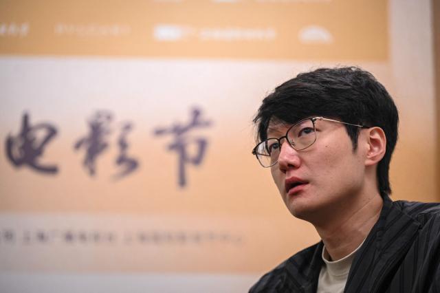 Chinese filmmaker Qiu Sheng takes part in an interview with AFP during the 28th Shanghai International Film Festival in Shanghai on June 17, 2026. (Photo by Jade GAO / AFP)