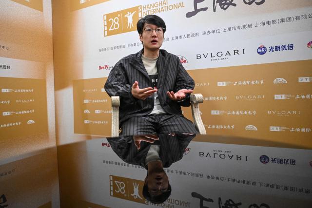 Chinese filmmaker Qiu Sheng takes part in an interview with AFP during the 28th Shanghai International Film Festival in Shanghai on June 17, 2026. (Photo by Jade GAO / AFP)